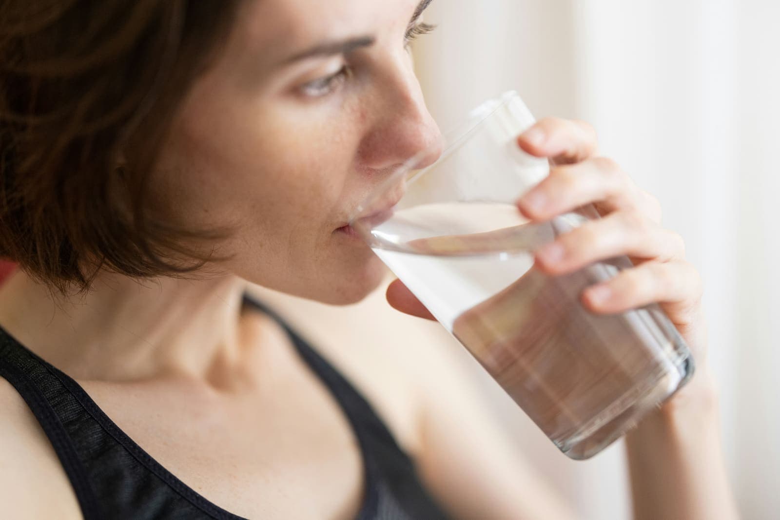 Woman enjoying clean water at home